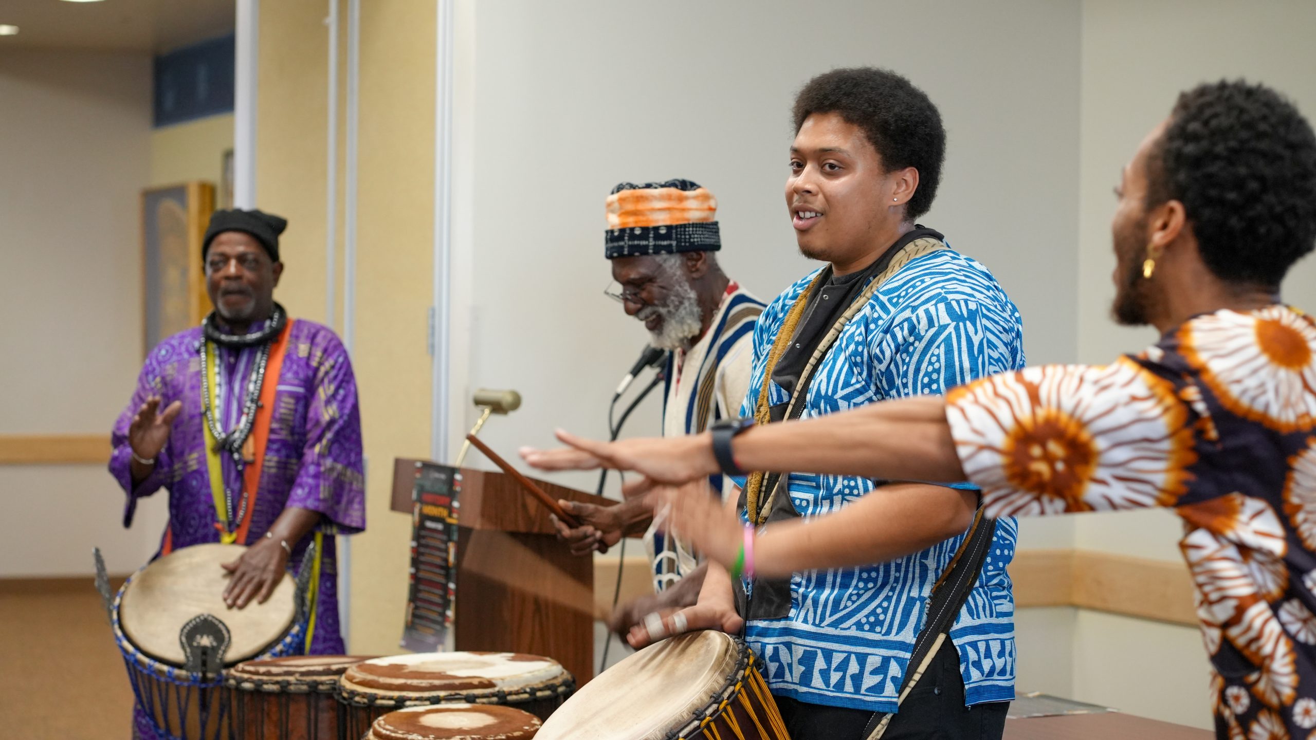 Performers playing African instruments